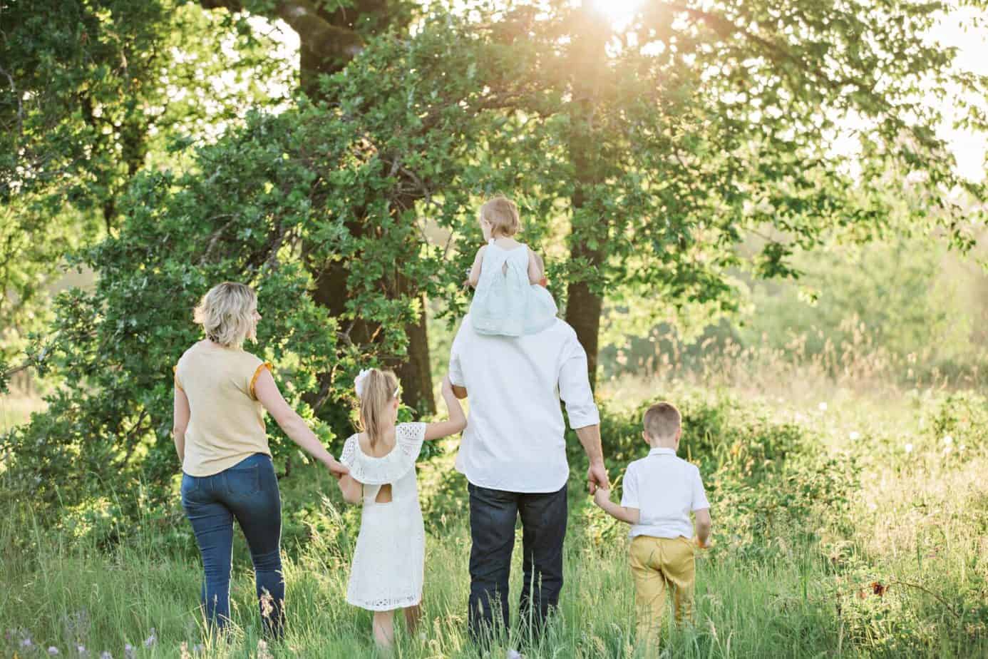 Booking a Family Holiday: Tips for making savings
family of five walking towards a tree