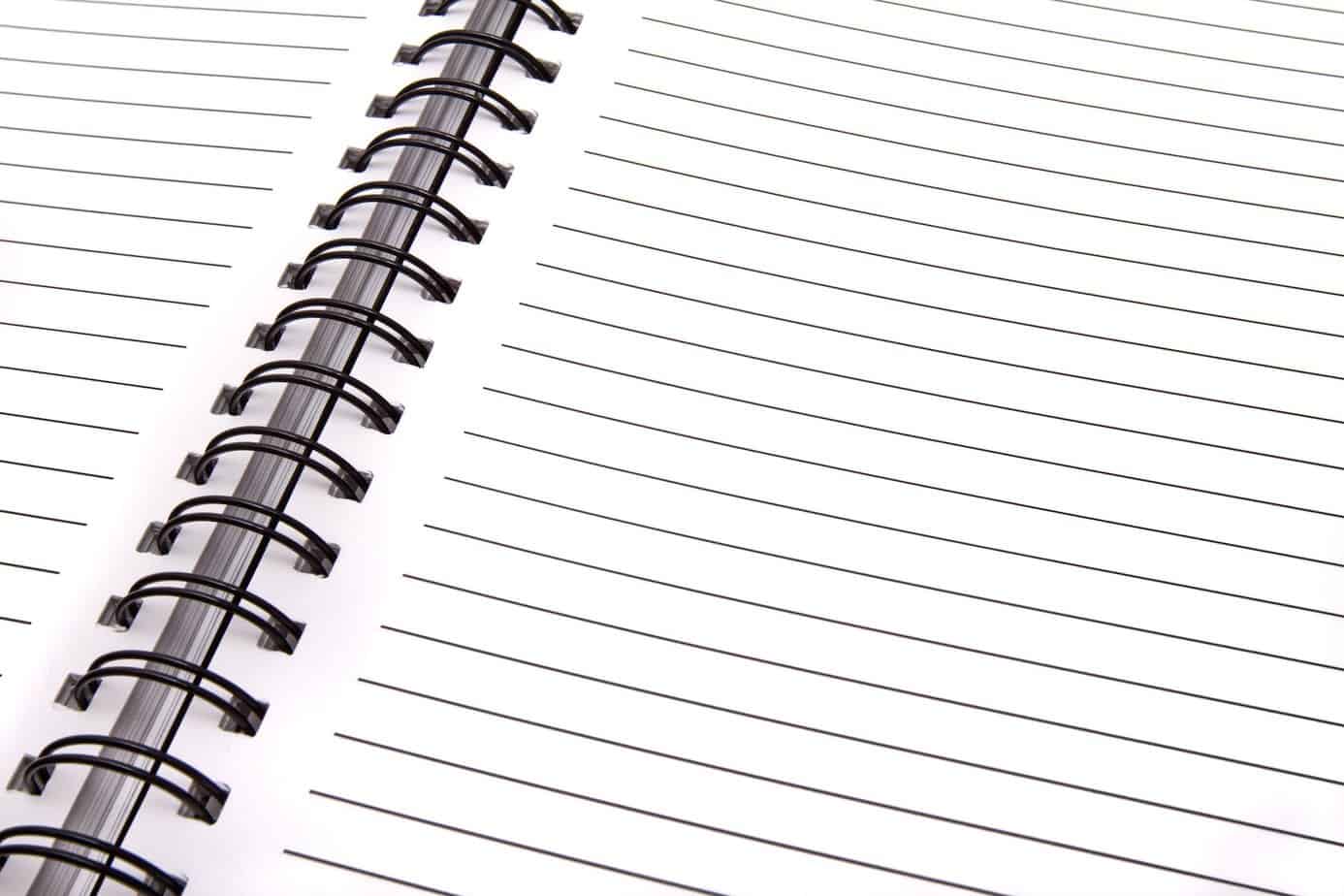 Let go of the January blues and focus on the year ahead - low angle view of spiral notebook