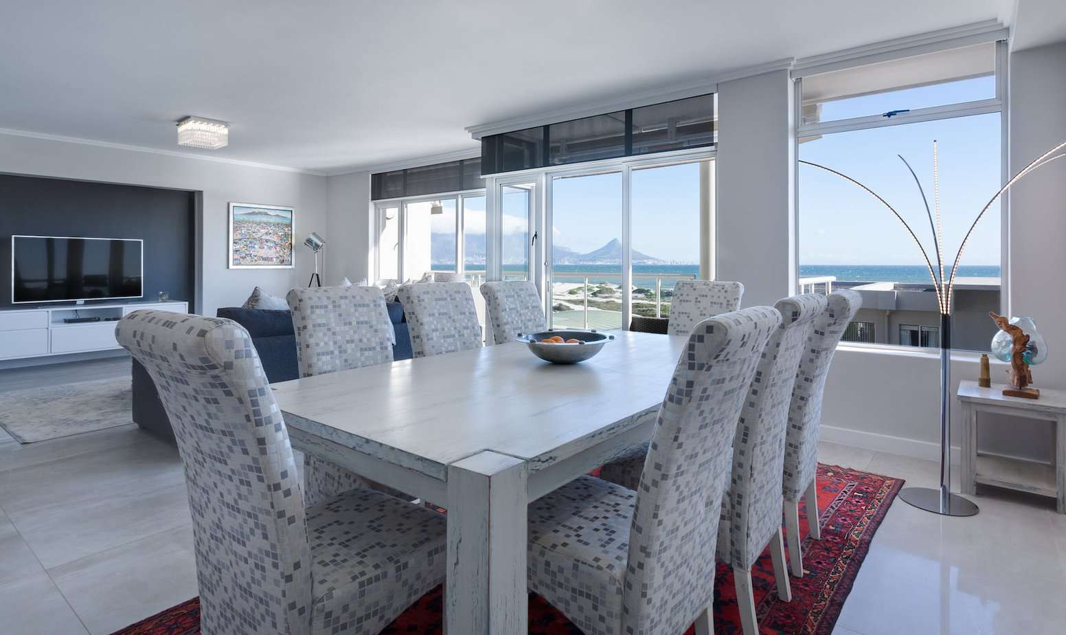 rectangular white wooden table with chairs - Creating an Inviting Dining Room Ambiance: Lighting, Decor, and More