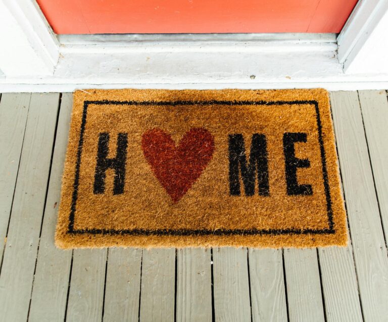 brown home printed rug beside door