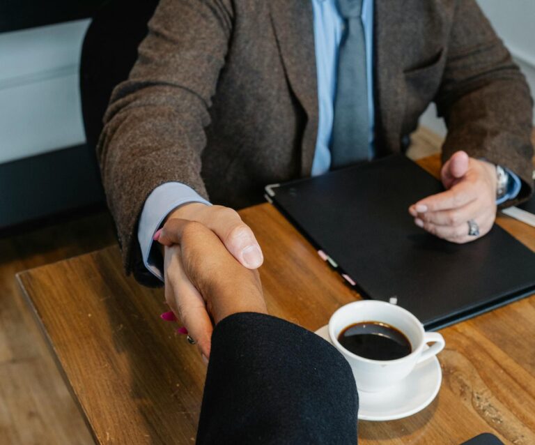 crop businesspeople making deal during workday